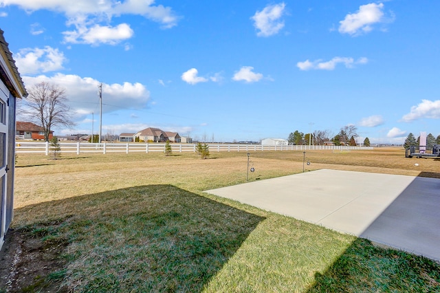 view of yard with a patio area and a rural view