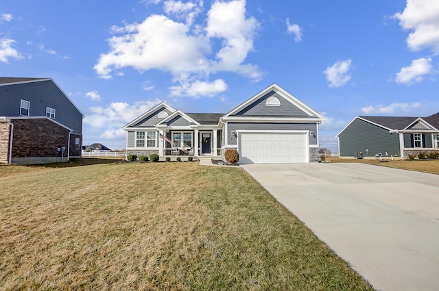 view of front of house with a garage and a front yard