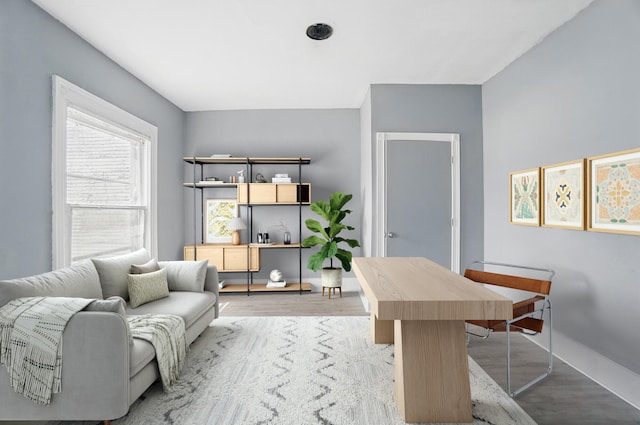 home office featuring baseboards and light wood-style floors