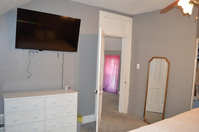 carpeted bedroom with a ceiling fan