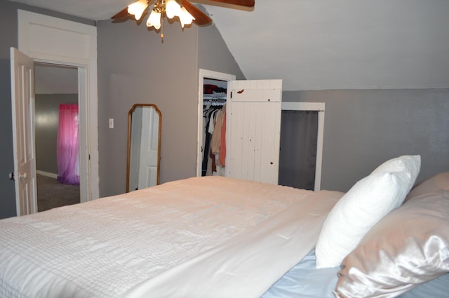 bedroom featuring a closet, vaulted ceiling, and ceiling fan