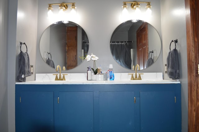 full bath with double vanity and a sink