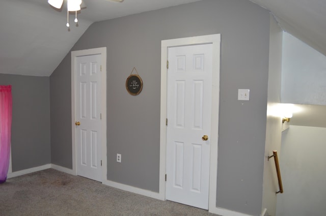 additional living space featuring lofted ceiling, baseboards, and carpet flooring