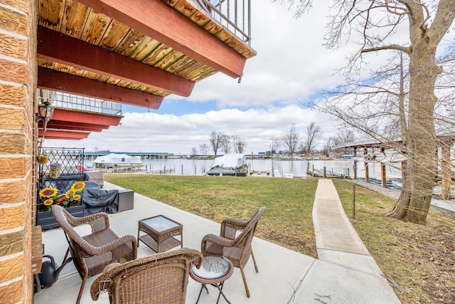 view of patio / terrace with a dock, boat lift, and a water view