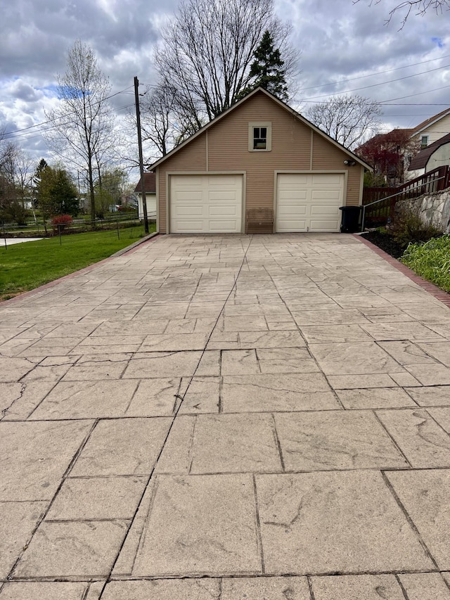 detached garage with fence