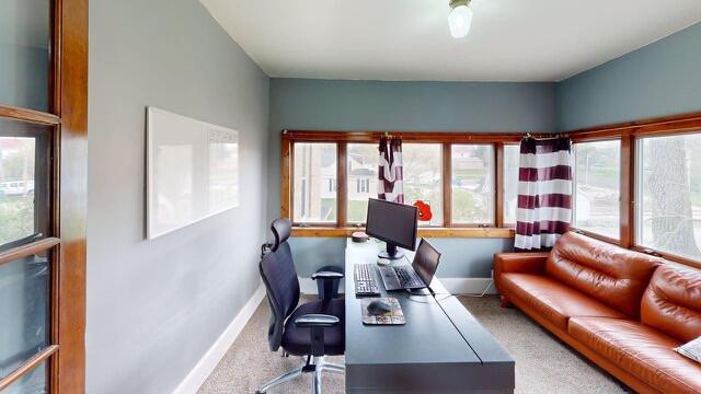 carpeted office with baseboards