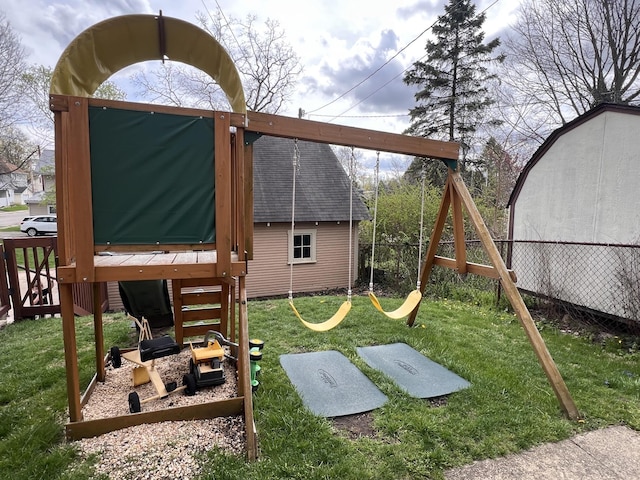 view of play area featuring fence and a yard