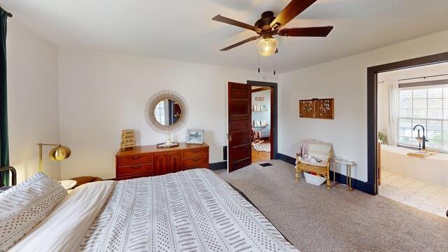 carpeted bedroom with baseboards and ceiling fan
