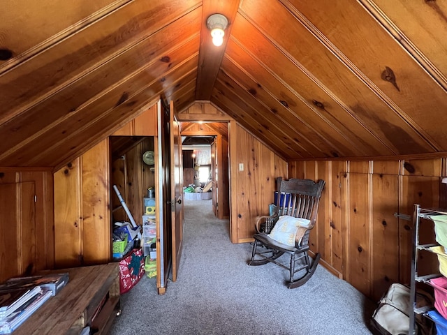 bonus room with wooden walls, lofted ceiling, and carpet flooring