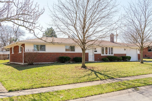 ranch-style house with a front lawn, a garage, and brick siding