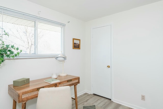 office featuring light wood finished floors and baseboards