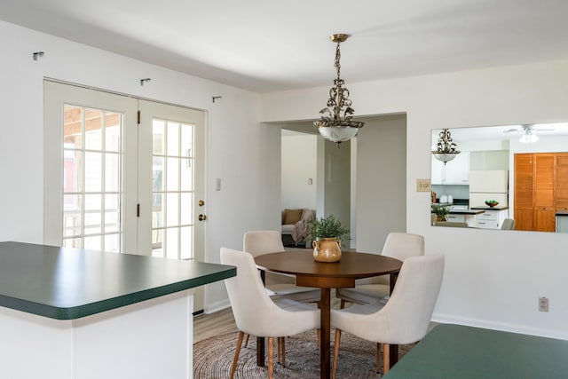 dining space featuring light wood finished floors