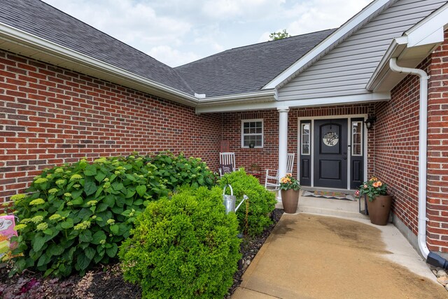 725 Loxley Ln, Troy, OH 45373 - doorway to property featuring brick siding and a shingled roof