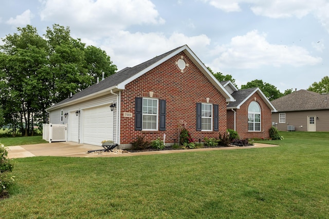 725 Loxley Ln, Troy, OH 45373 - view of front of house featuring brick siding, concrete driveway, a front lawn, and an attached garage