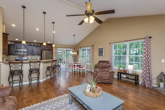 725 Loxley Ln, Troy, OH 45373 - living room with baseboards, dark wood-type flooring, a chandelier, recessed lighting, and high vaulted ceiling
