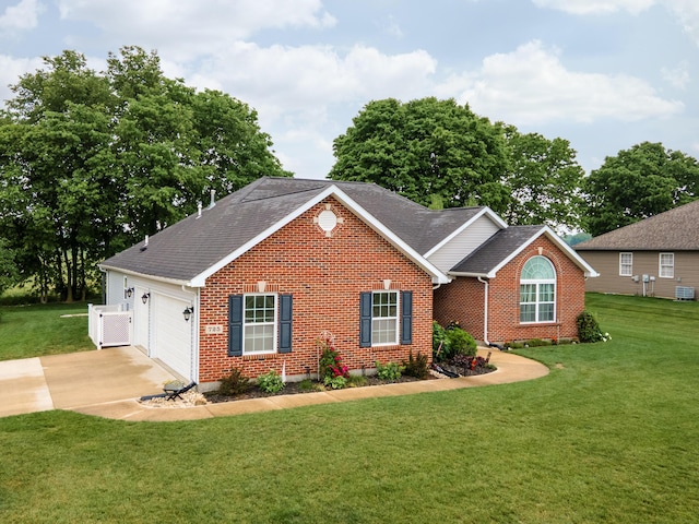 725 Loxley Ln, Troy, OH 45373 - view of front of property featuring a shingled roof, a front lawn, brick siding, and concrete driveway