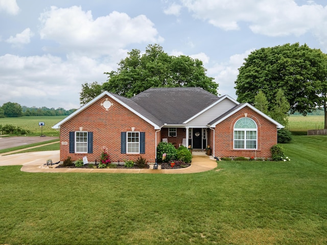 725 Loxley Ln, Troy, OH 45373 - ranch-style home with brick siding, a front lawn, and a shingled roof