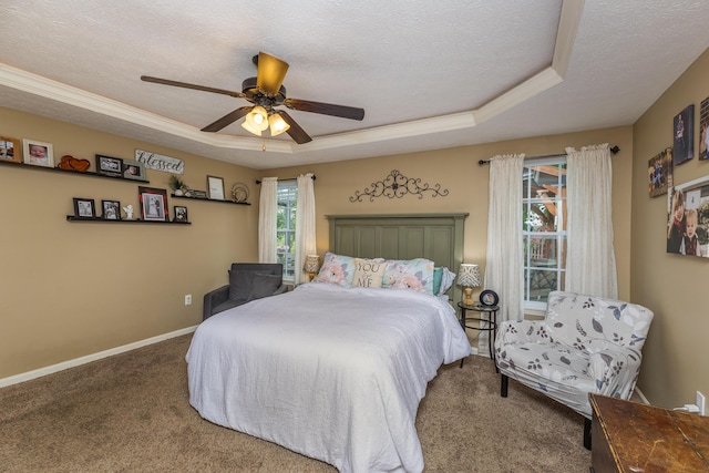 725 Loxley Ln, Troy, OH 45373 - carpeted bedroom featuring a tray ceiling, a textured ceiling, baseboards, and ceiling fan