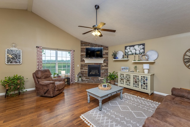 725 Loxley Ln, Troy, OH 45373 - living room with a ceiling fan, lofted ceiling, a fireplace, wood finished floors, and baseboards