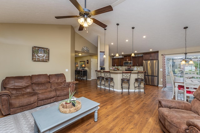 725 Loxley Ln, Troy, OH 45373 - living room with a ceiling fan, wood finished floors, lofted ceiling, baseboards, and recessed lighting