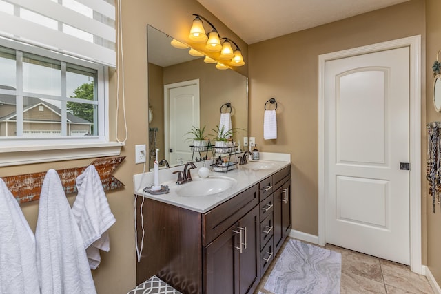725 Loxley Ln, Troy, OH 45373 - bathroom with double vanity and baseboards