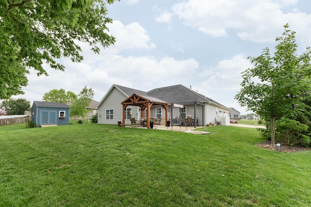 725 Loxley Ln, Troy, OH 45373 - back of property featuring a gazebo, a lawn, a patio, and a garage