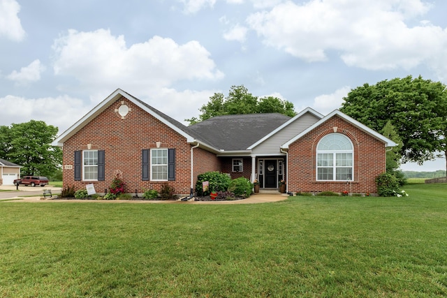 725 Loxley Ln, Troy, OH 45373 - view of front facade with brick siding and a front yard