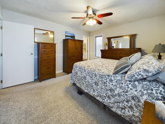 bedroom featuring light carpet and ceiling fan