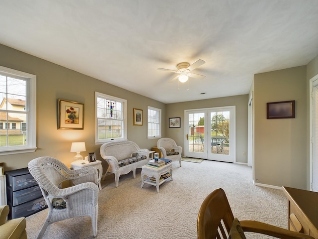 carpeted living room featuring ceiling fan