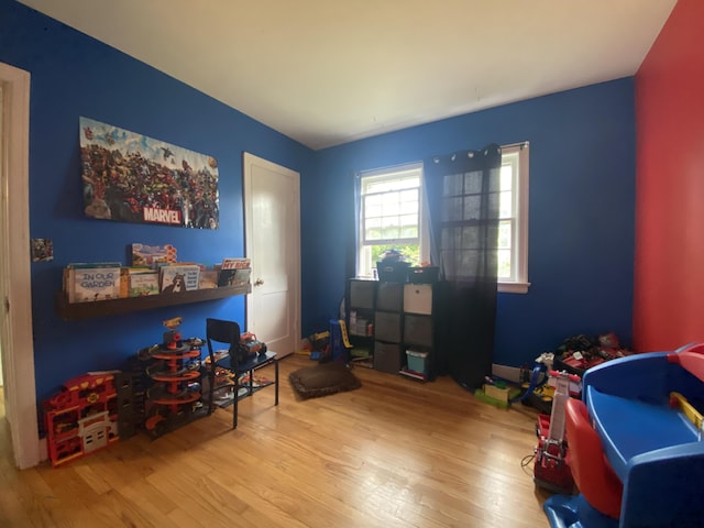 recreation room with wood finished floors