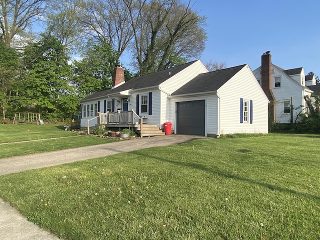 view of front of house featuring driveway, a chimney, a deck, a front lawn, and an attached garage