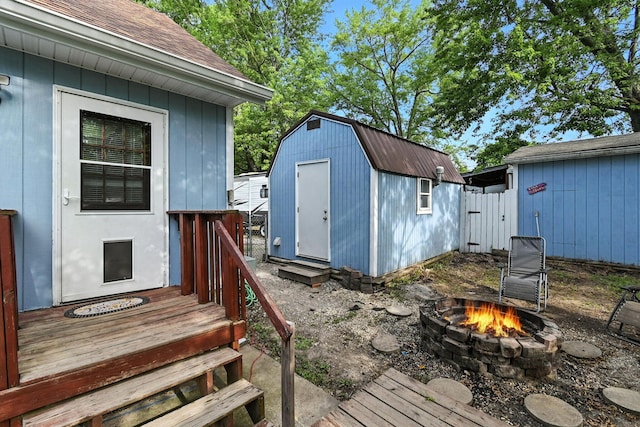 11372 Kickapoo Path, Lakeview, OH 43331 - deck with an outdoor fire pit and a shed