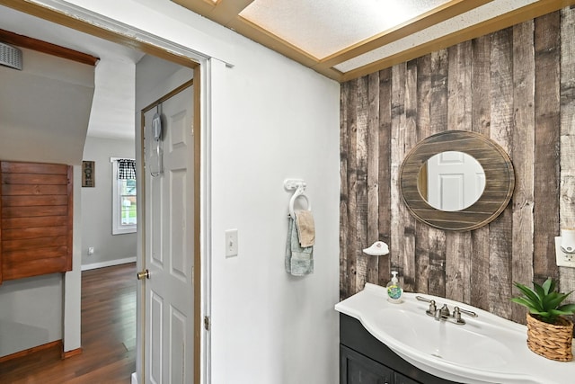 11372 Kickapoo Path, Lakeview, OH 43331 - bathroom featuring wood finished floors, vanity, and wooden walls
