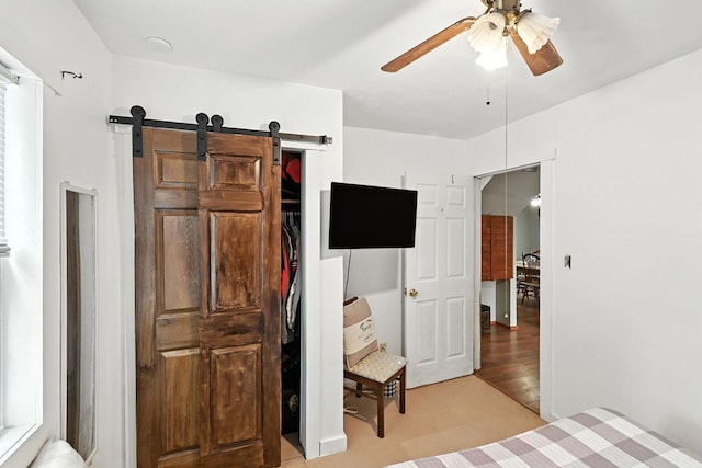 11372 Kickapoo Path, Lakeview, OH 43331 - bedroom featuring a barn door and a ceiling fan