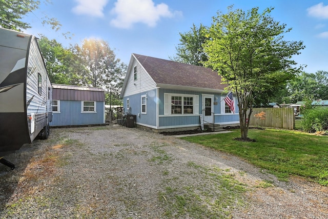 11372 Kickapoo Path, Lakeview, OH 43331 - bungalow-style home featuring an outbuilding, driveway, and a shingled roof