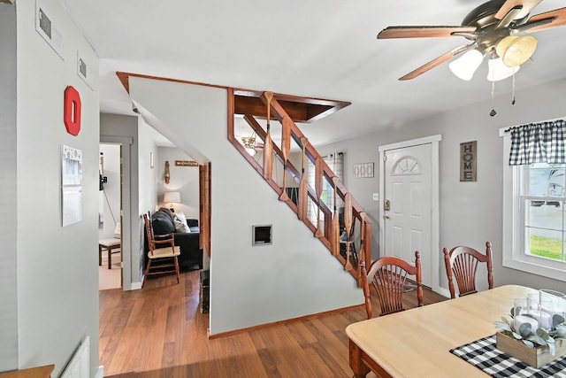 11372 Kickapoo Path, Lakeview, OH 43331 - dining room featuring stairway, wood finished floors, and a ceiling fan