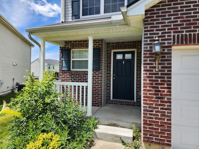 2380 W Patterson Ln, Troy, OH 45373 - doorway to property with brick siding and a porch