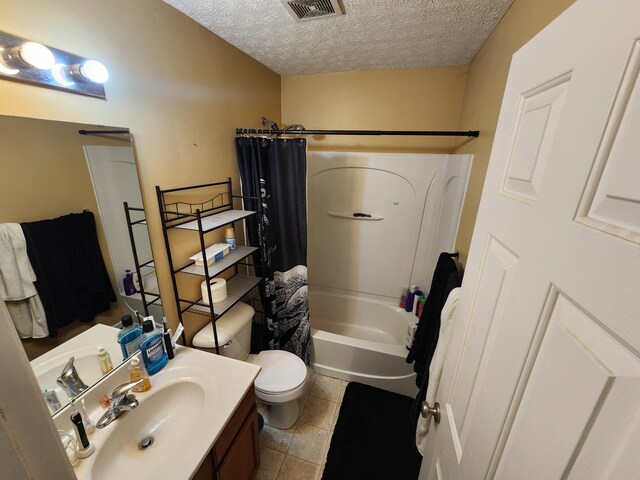 2380 W Patterson Ln, Troy, OH 45373 - bathroom featuring shower / tub combo, vanity, a textured ceiling, and tile patterned floors