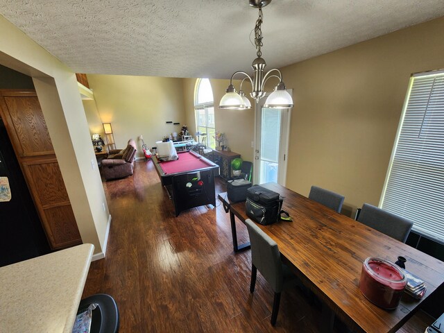 2380 W Patterson Ln, Troy, OH 45373 - dining room featuring dark wood-style floors, a chandelier, and a textured ceiling