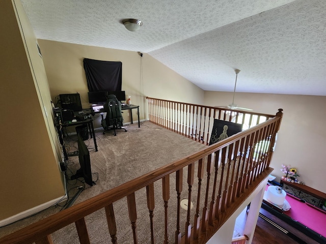 2380 W Patterson Ln, Troy, OH 45373 - stairs with vaulted ceiling, a ceiling fan, carpet, and a textured ceiling