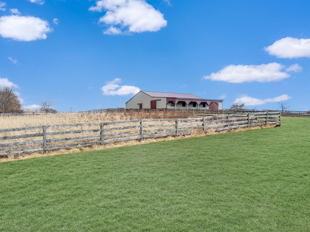 view of yard featuring a rural view and fence