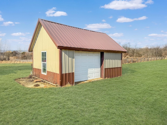 view of outdoor structure with an outbuilding and fence