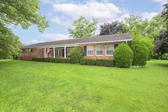 5714 Hickory Dr, West Liberty, OH 43357 - single story home with brick siding and a front lawn