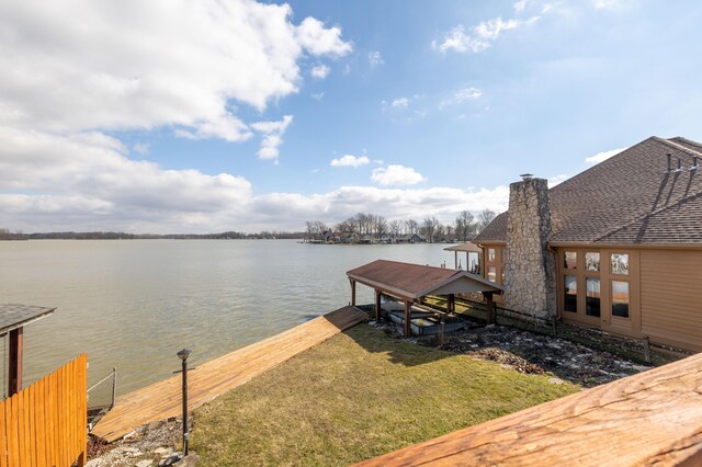 10989 Seminole Shore Dr, Huntsville, OH 43324 - dock with a water view, a yard, and boat lift