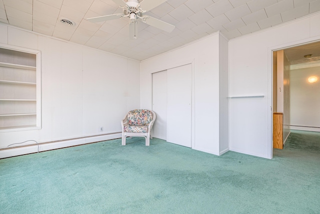 10989 Seminole Shore Dr, Huntsville, OH 43324 - unfurnished room with carpet flooring, baseboard heating, and a ceiling fan