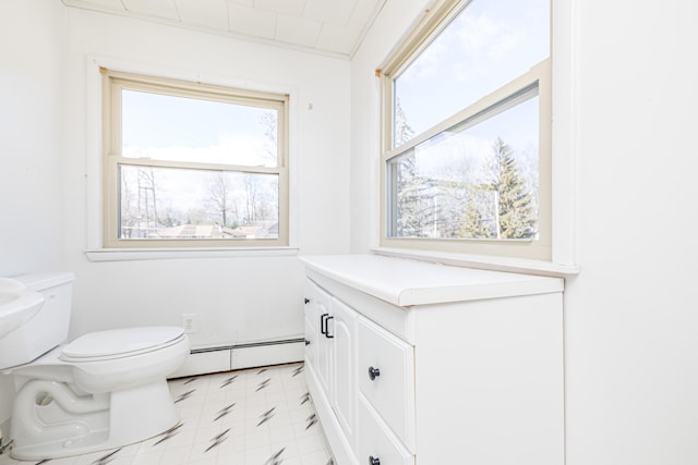 10989 Seminole Shore Dr, Huntsville, OH 43324 - half bathroom featuring a baseboard heating unit, toilet, plenty of natural light, and tile patterned floors
