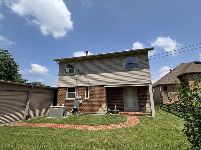 10989 Seminole Shore Dr, Huntsville, OH 43324 - back of property with brick siding and central AC