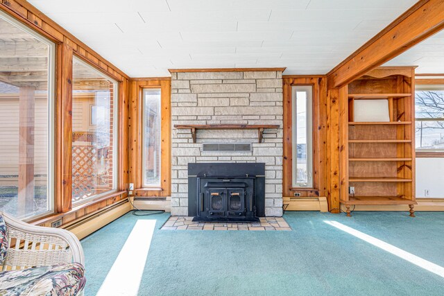 10989 Seminole Shore Dr, Huntsville, OH 43324 - unfurnished living room with carpet flooring, a baseboard heating unit, and wooden walls