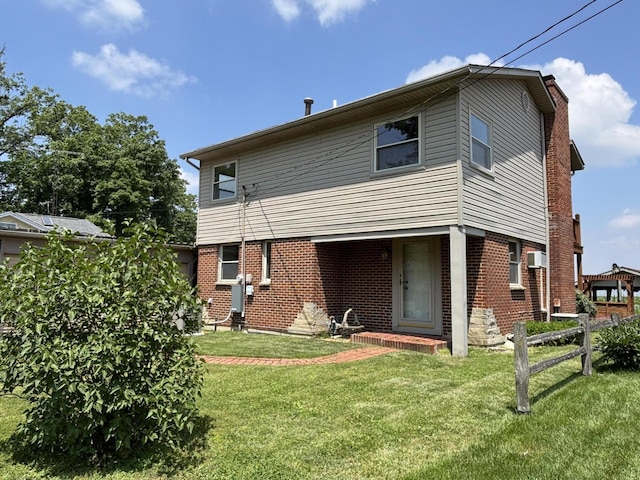 10989 Seminole Shore Dr, Huntsville, OH 43324 - back of house featuring brick siding and a chimney