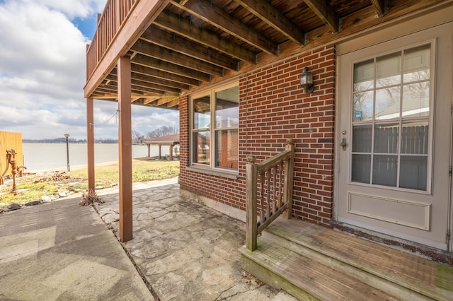 10989 Seminole Shore Dr, Huntsville, OH 43324 - view of patio with a water view